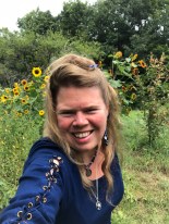 Arianna Collins among sunflowers